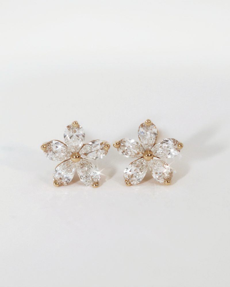 Pear cut diamond flower stud earrings front view