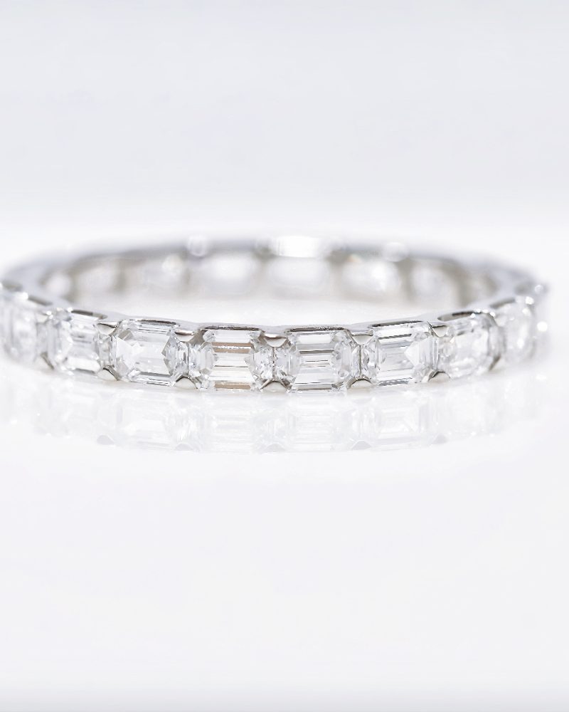 Emerald cut eternity diamond ring