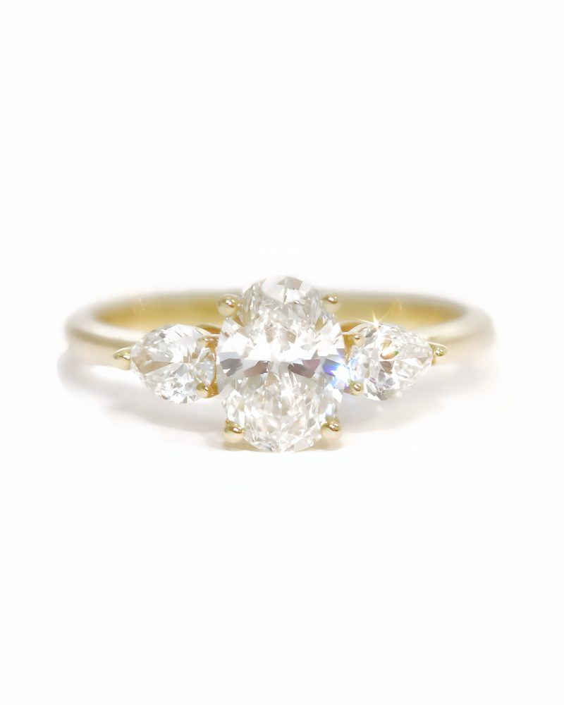 Oval & Pear Cut Three Stone Diamond Ring